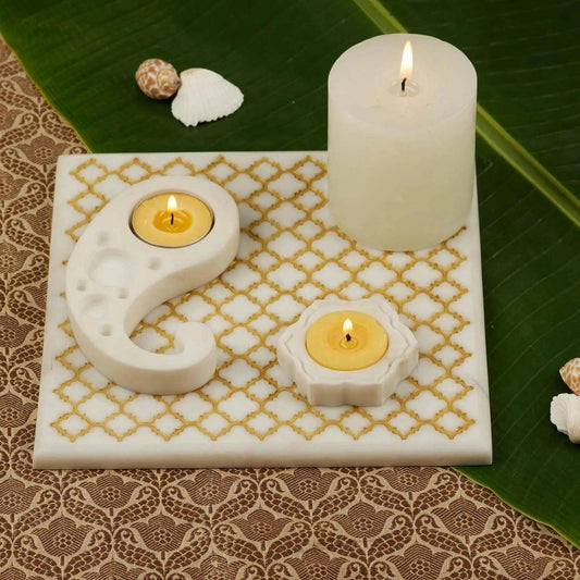 Celebration Marble Trivet Set with Gold Finish.