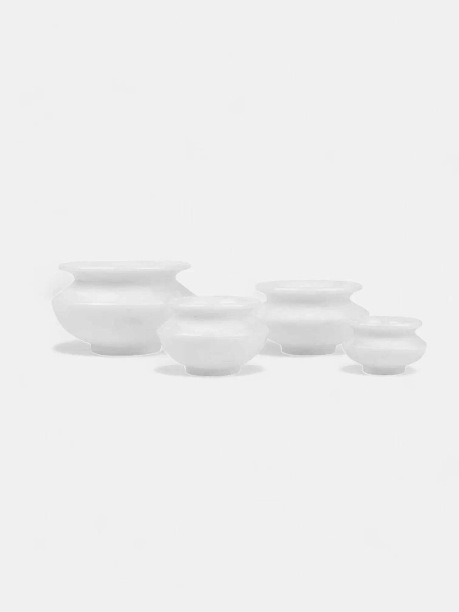 Set of 4 White Marble Candle Pots.