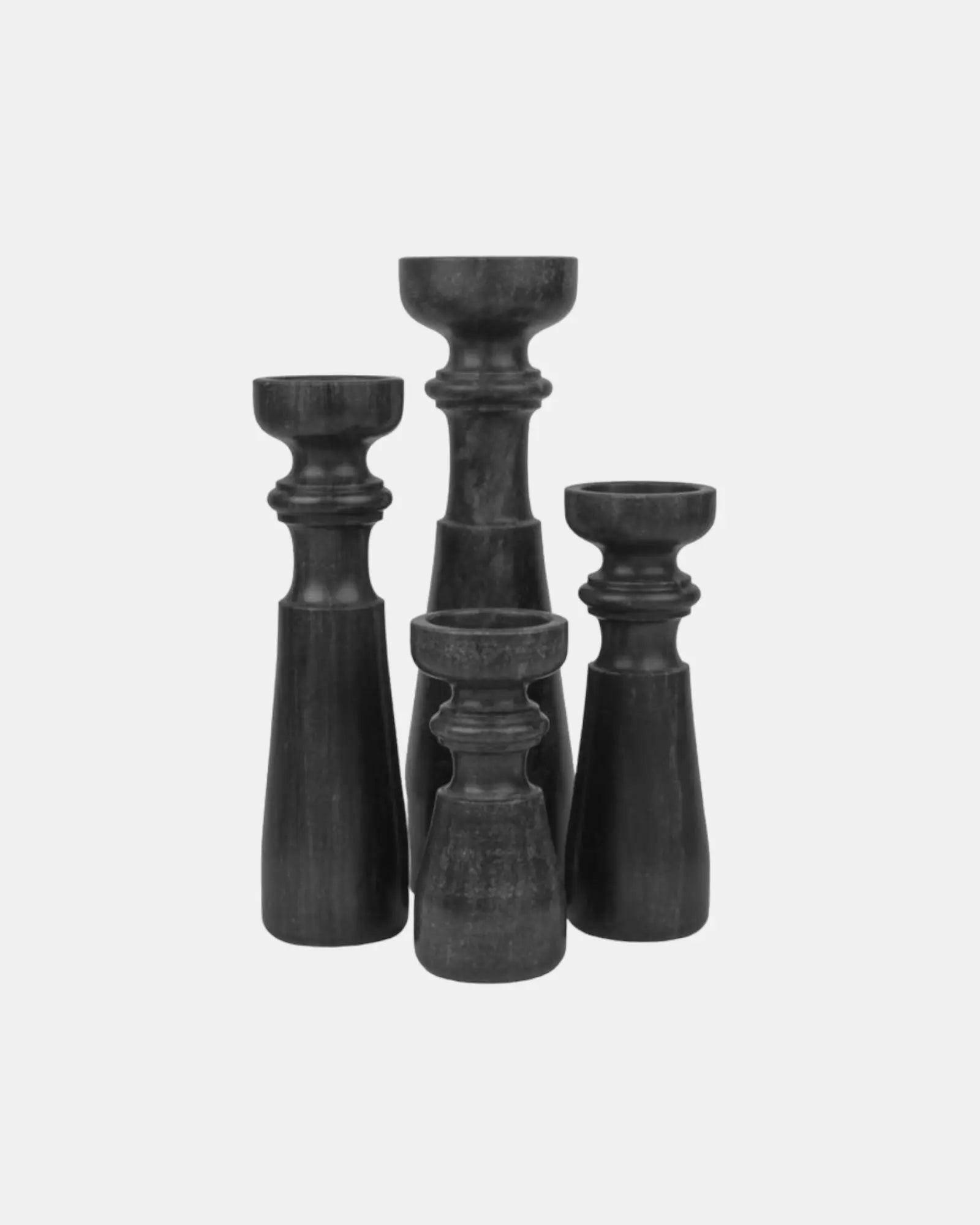 Set of Four Black Marble Candleholders.